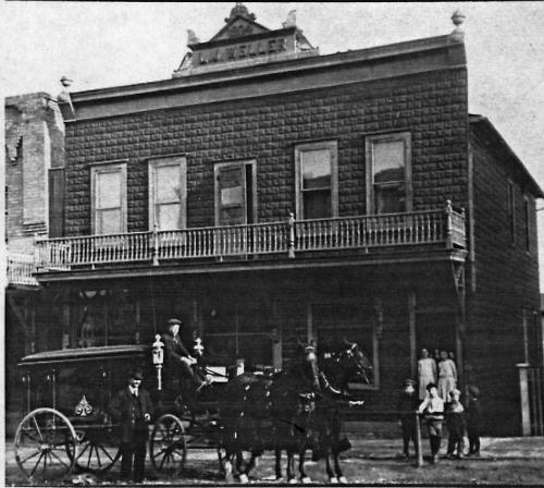 L.M. Weller store and residence with hearse in front - 1912