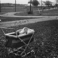 Susan Rojina in baby carriage - October 1957
