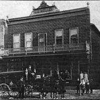 L.M. Weller store and residence with hearse in front - 1912