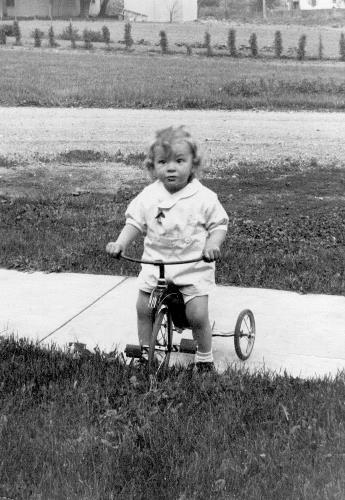 Howard Meuwissen on his tricycle - circa 1936