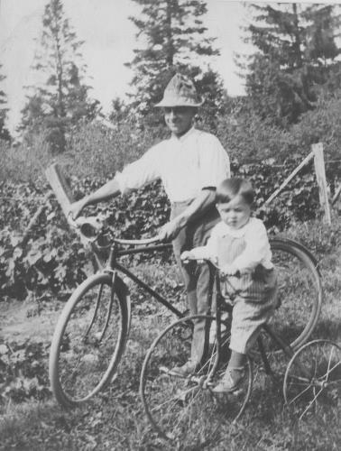 L.G. Lawson and son, Charles  with bicycle and tricycle - 1918