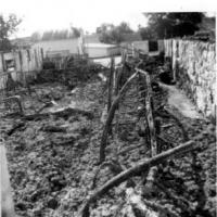 Remains of Harold an Leona Kerber's barn after fire on August 25, 1964.