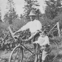 L.G. Lawson and son, Charles  with bicycle and tricycle - 1918